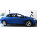 Wall-Mounted Residential LCS Station Recharging Blue Chevy Volt in Garage